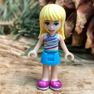 Stephanie wearing a Medium Azure Skirt and Striped Top - Friends, Genuine LEGO® Minifigure