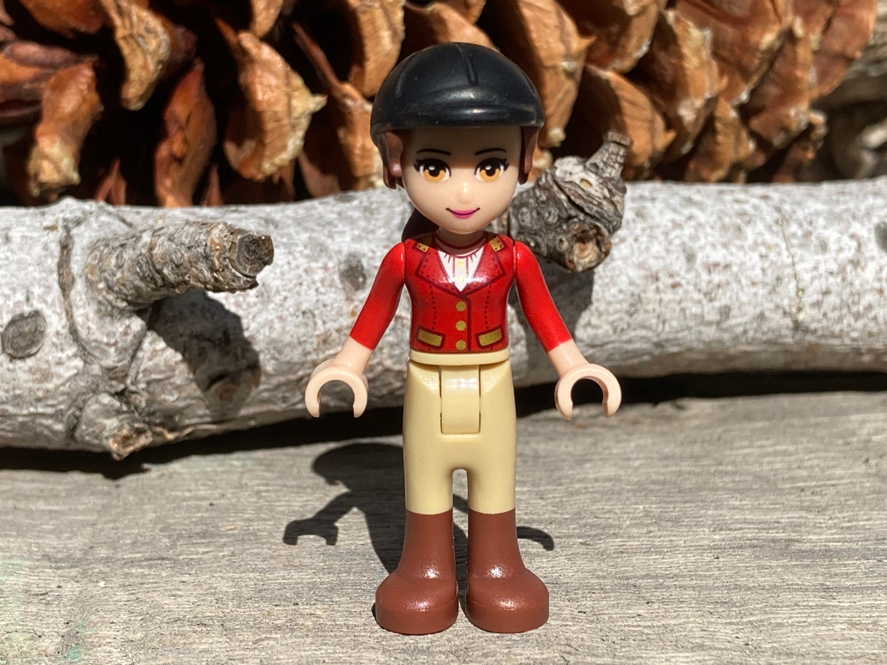 Olivia, Tan Riding Pants, Red Jacket, Black Riding Helmet