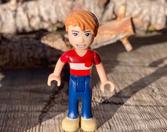 Henry wearing a Dark Red Polo Shirt and Dark Blue Pants - Friends, Genuine LEGO® Minifigure