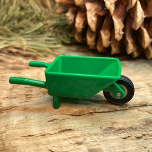 Green Minifigure Wheelbarrow Frame with Medium Stone Gray Pulley Wheel and Black Tire - Genuine LEGO® Accessory