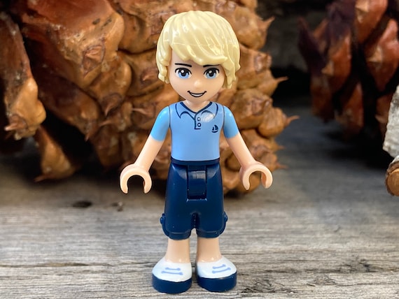 Andrew Wearing Dark Blue Cropped Trousers and a Bright Light Blue