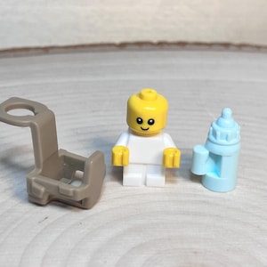 Bebé de camping con biberón y portabebés: minifigura LEGO® original