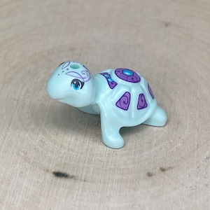 Light Aqua Turtle with Medium Azure Eyes, Dark Azure Jewels, and Dark Purple and Medium Lavender Shell (Calypso) - Genuine LEGO® Animal