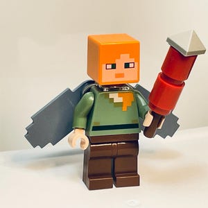 Alex Wearing Elytra Holding Fireworks – Genuine LEGO® Minifigure