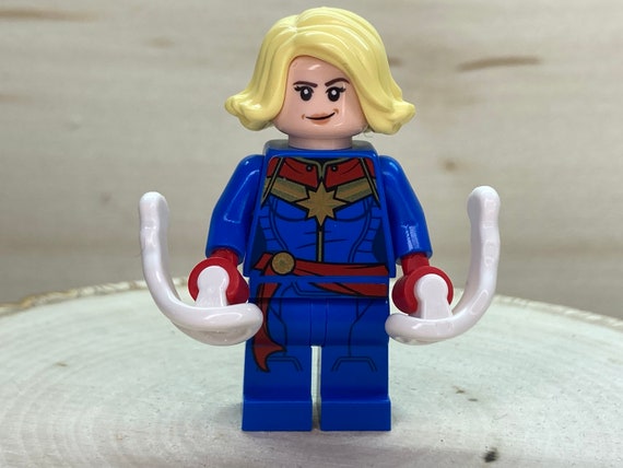 Captain Marvel With Bright Light Yellow Hair Super Heroes