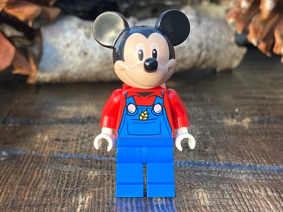 Mickey Mouse Wearing Blue Coveralls and 