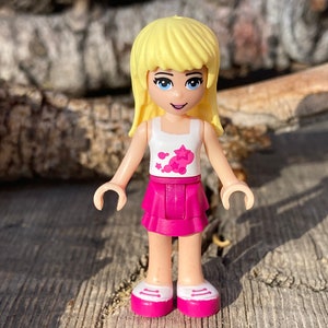 Stephanie wearing a Magenta Layered Skirt and White Top - Friends - LEGO® minifigure