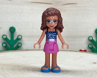 Olivia wearing a Dark Pink Skirt, Dark Blue Top with Constellations  Friends, Genuine LEGO® Minifigure