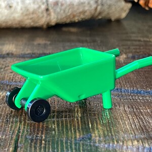 Green Minifigure Wheelbarrow Frame with Black Wheels - Genuine LEGO® Accessory