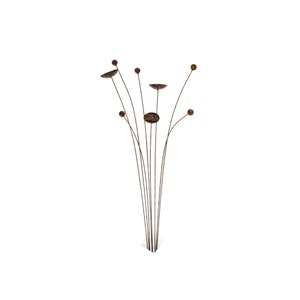 Kinetic metal garden art with rust patina.