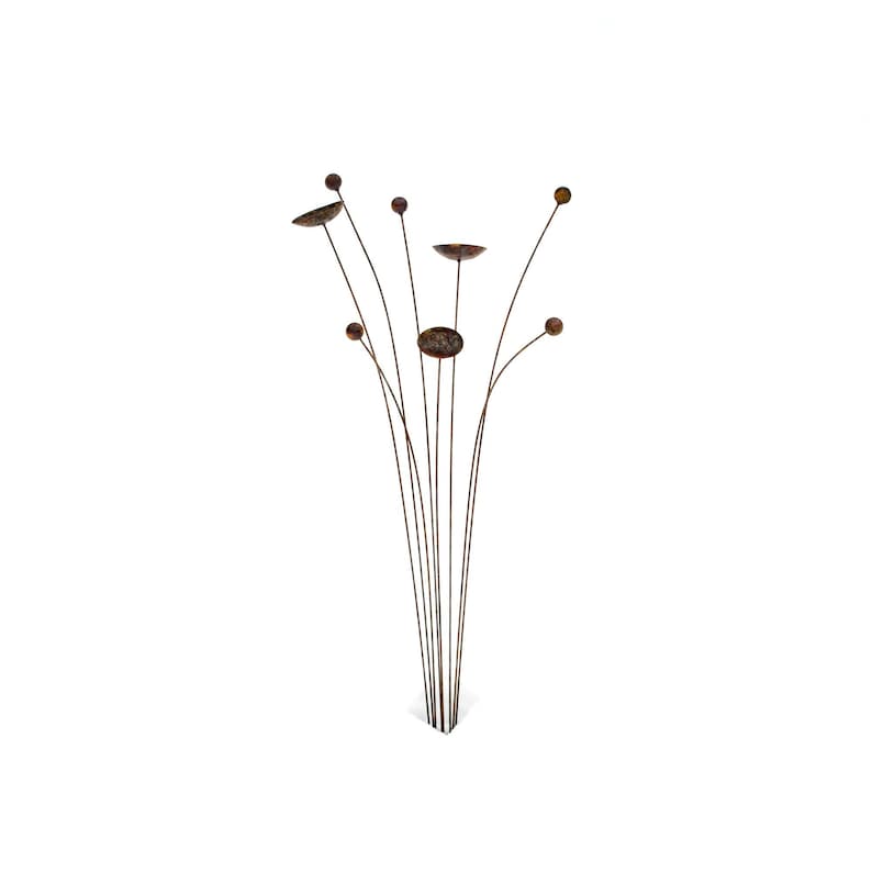 Kinetic metal garden art with rust patina.