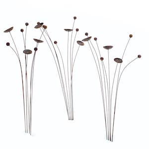 Three sets of metal kinetic garden art with rust patina creates an impact and mimics natural plantings.