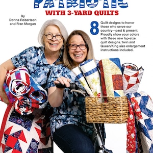 May include: Two women are holding and riding a bicycle with a basket full of red, white, and blue quilts. The text on the image reads "Make it Patriotic with 3-yard Quilts".