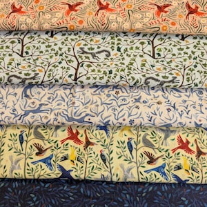 May include: Five folded layers of patterned fabric. The top layer is peach with red birds and orange flowers. The second is white with green trees and gray squirrels. The third is cream with blue dogs and vines. The fourth is yellow with colorful birds and green branches. The bottom is dark blue with small leaves.