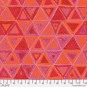 May include: Close-up of a fabric with a geometric pattern of triangles in shades of red, orange, and pink. The triangles are filled with small dots, creating a textured effect. The fabric is measured in inches.