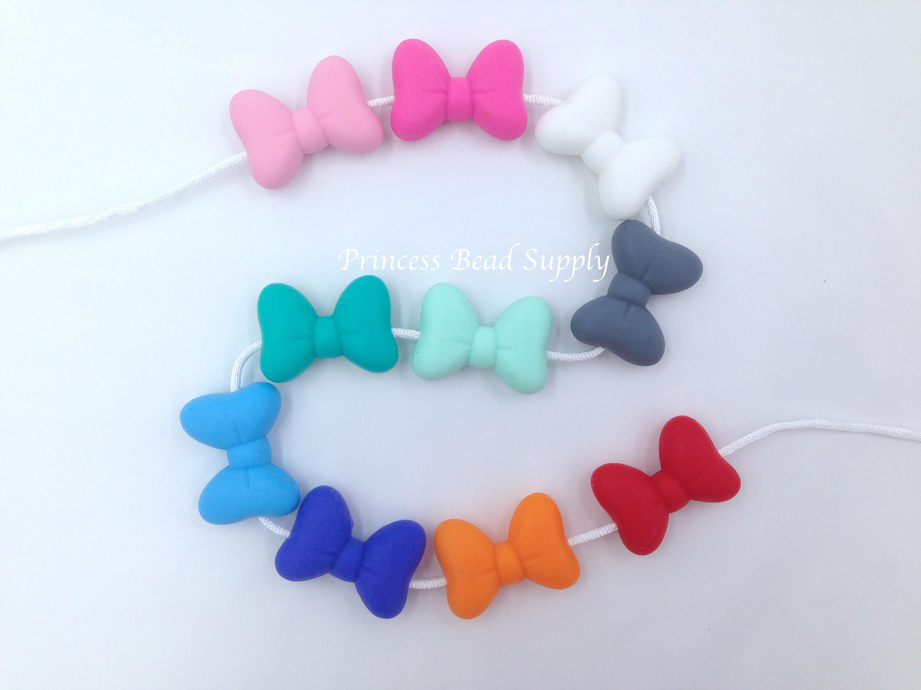 (3) White Silicone Bow Beads