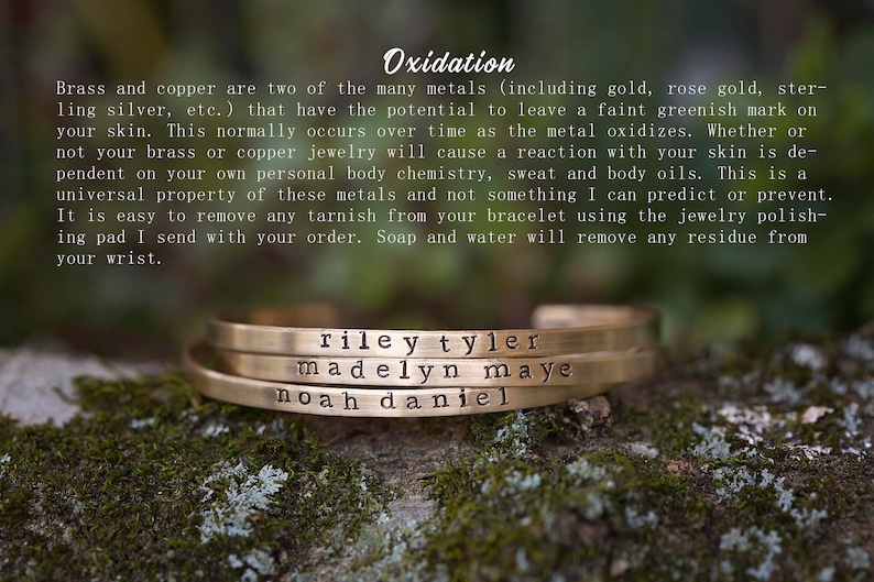 May include: Three gold-colored metal bracelets stacked on top of each other, each engraved with a name. The top bracelet reads "riley tyler", the middle one "madelyn maye", and the bottom one "noah daniel". The bracelets are displayed on a mossy surface.