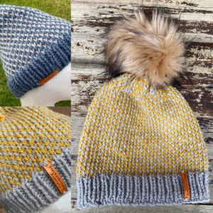 May include: Two knitted hats with a gray and yellow pattern. One hat has a faux fur pom pom on top. Both hats have a brown leather tag with the text "Stacey Lewis Australia".