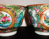 Pair of late Qing dynasty or earlier Republic Chinese porcelain tea cups detail painted Canton enamel medallion court figurines