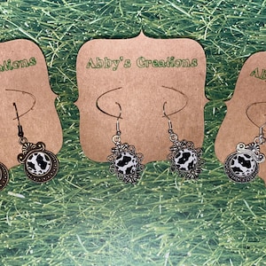 Cow print earrings with vintage setting, cow lovers, cows, moo, cattle, bronze bezel, silver bezel, fish hook earrings