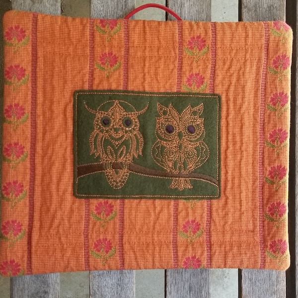 Owls on a branch, hand-digitized embroidered design, wall hanging, or padded trivet, replica of Voysey Owls textile (1913) on reverse.