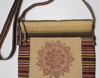 Mandala Crossbody bag, messenger bag, outer pocket, zipper closure, earth tone striped canvas, tiole de jouy lining, removable strap.
