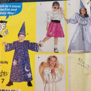 May include: A sewing pattern book titled "Sewing Patterns For Dummies" features children's costume designs. The costumes include a wizard, an angel, and a girl in a poodle skirt. The cover has the text "Catch up a storm the Fun and Easy Way."