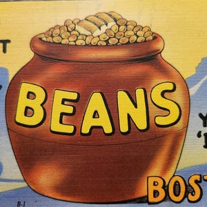 May include: A vintage postcard with a cartoon illustration of a brown bean pot filled with beans. The text on the postcard reads "You don't know beans till you've 'bean' to Boston!"
