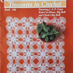 May include: An orange book cover with the title "Treasures in Crochet" and the J. & P. Coats logo. The cover features a white crocheted doily and a small potted plant. The book is labeled "Book 296".