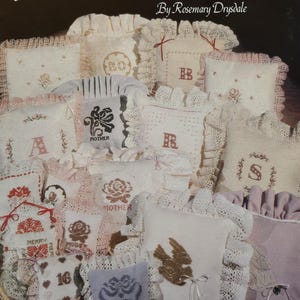 May include: A collection of 12 counted bead embroidery patterns for pillows, featuring various designs including flowers, letters, numbers, and a dove. The patterns are titled "Beaded Celebrations" by Rosemary Drysdale.