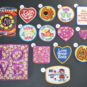 May include: A collection of 14 iron-on patches with various designs and colors, featuring the word "love" in different styles and fonts. The patches are perfect for adding a touch of personality to clothing, bags, or other accessories.