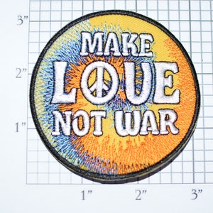 May include: A round, yellow, blue, and white embroidered patch with the text "Make Love Not War" and a peace sign.