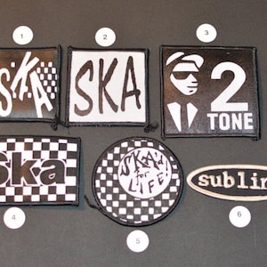 May include: Six black and white embroidered patches with various ska band logos. The patches include "Ska", "Ska! for Life", "2 Tone", and "Sublime".
