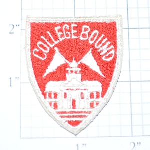 May include: A red and white embroidered patch in a shield shape. The patch reads "COLLEGE BOUND" in white lettering. Below the text is a white building with two white flags. The patch measures approximately 2 inches in height.