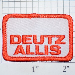 May include: Red embroidered patch with white background and the text "DEUTZ ALLIS" in red.