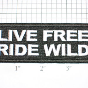 May include: Black embroidered patch with white text that reads "LIVE FREE RIDE WILD".