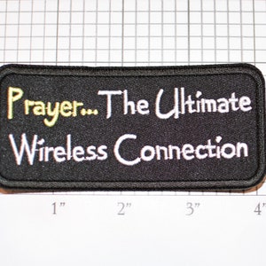 May include: Black embroidered patch with white text that reads "Prayer... The Ultimate Wireless Connection".