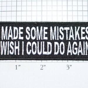 May include: Black embroidered patch with white text that reads "I made some mistakes I wish I could do again".