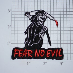 May include: Black and white embroidered iron-on patch featuring a grim reaper holding a scythe with a red drop of blood. The patch has the text "FEAR NO EVIL" in red embroidery.