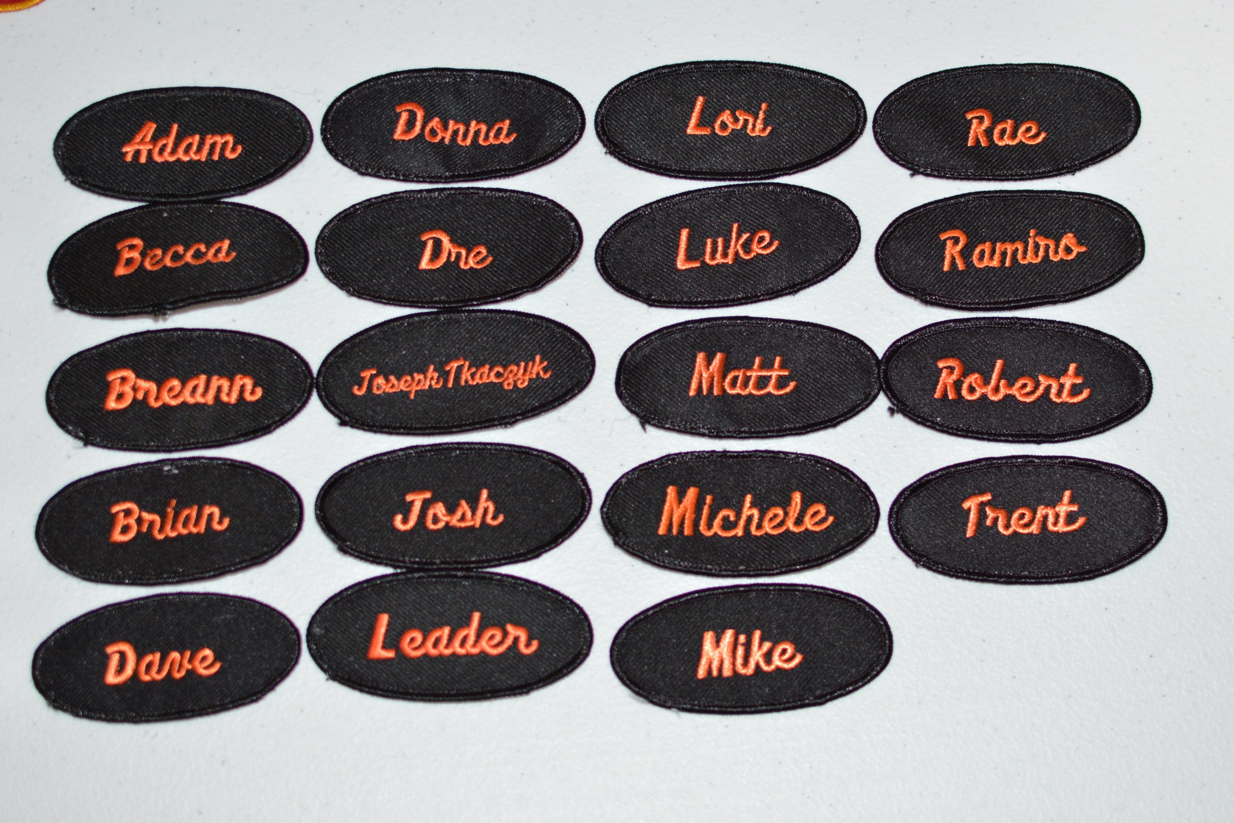 Orange on Black Vintage Embroidered Clothing Name Patch for