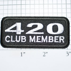 May include: Black embroidered patch with white text that reads "420 CLUB MEMBER".
