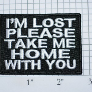 May include: Black embroidered patch with white text that reads "I'M LOST PLEASE TAKE ME HOME WITH YOU".