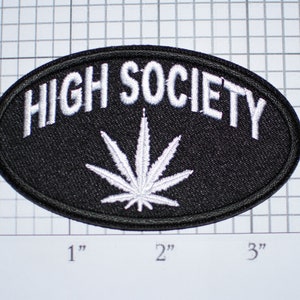 May include: Black oval patch with white embroidered text "HIGH SOCIETY" and a white marijuana leaf design.