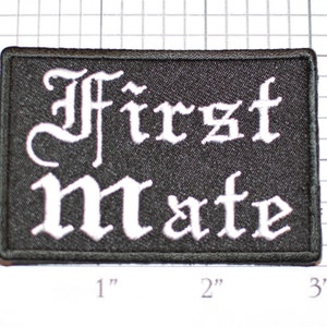 May include: Black rectangular patch with the words "First Mate" in white gothic lettering. The patch measures approximately 3 inches wide and 2 inches tall.