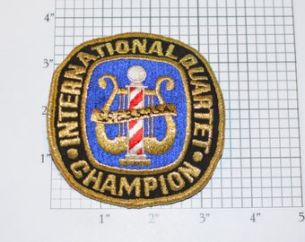 International Quartet Champion SPEBSQSA Embroidered Pin (Society for Preservation & Encouragement of Barber Shop Quartet Singing in America)