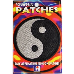 May include: A black and white yin yang symbol iron-on patch. The patch is on a colorful card with the text "Psychedelic Patches" and "Easy Application Iron-On Patches".