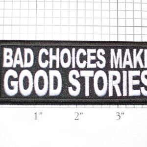 May include: Black and white embroidered patch with the text "BAD CHOICES MAKE GOOD STORIES".