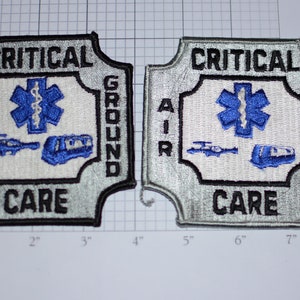 May include: Two silver and black embroidered patches with the text "CRITICAL AIR GROUND CARE" and a blue medical star with a snake and staff. The patches are 3 inches wide and 3 inches tall.