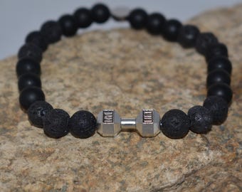 Pulsera con mancuernas: joyería elástica con cuentas de lava y ónix mate, regalo unisex para fitness.