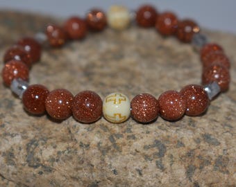 Pulsera cristiana de arenisca: dije de pez y cruz de Jesús